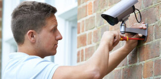 man following home security tips by installing CCTV