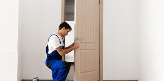 a locksmith who is changing locks on a rental property