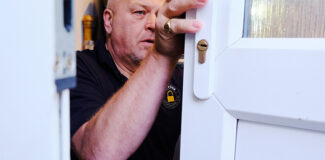 steve the locksmith inspecting a door that could be prone to lock snapping